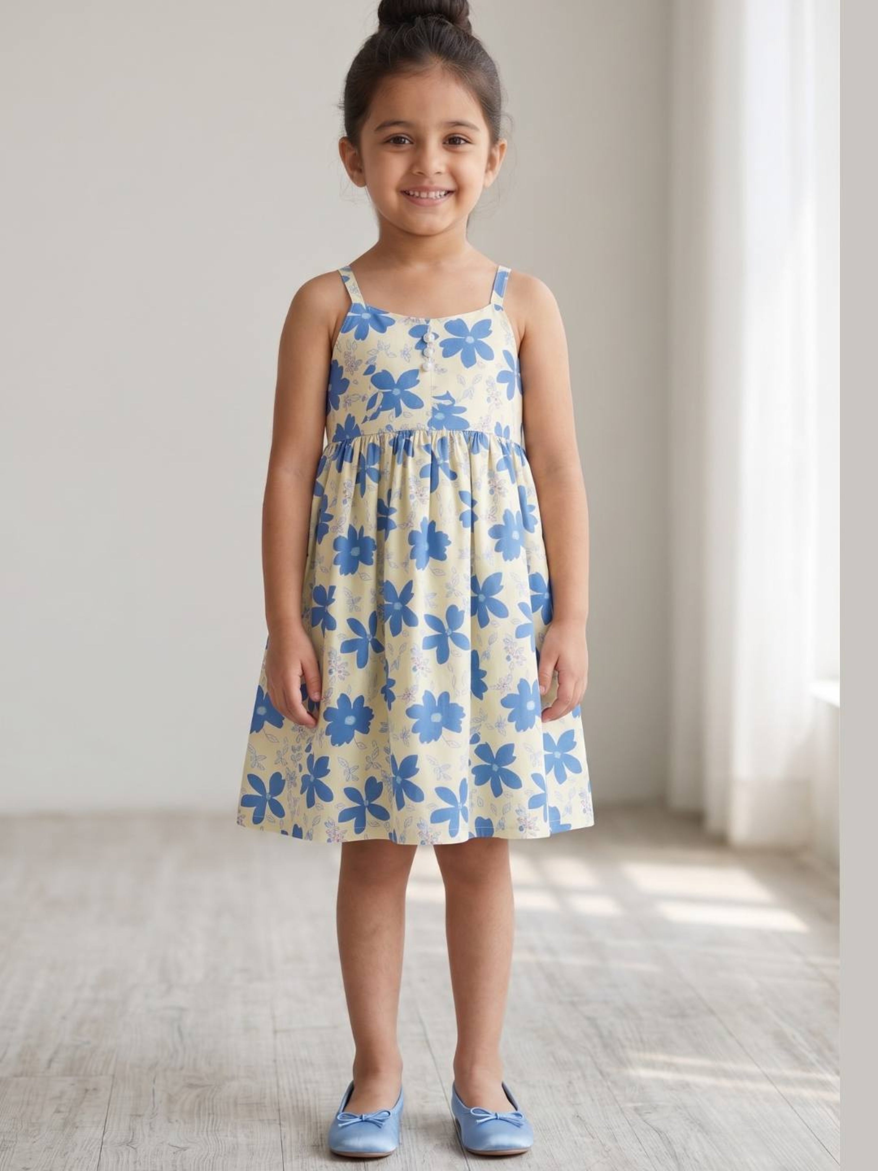 Blue floral printed sleeveless fit & flare dress for girls.
