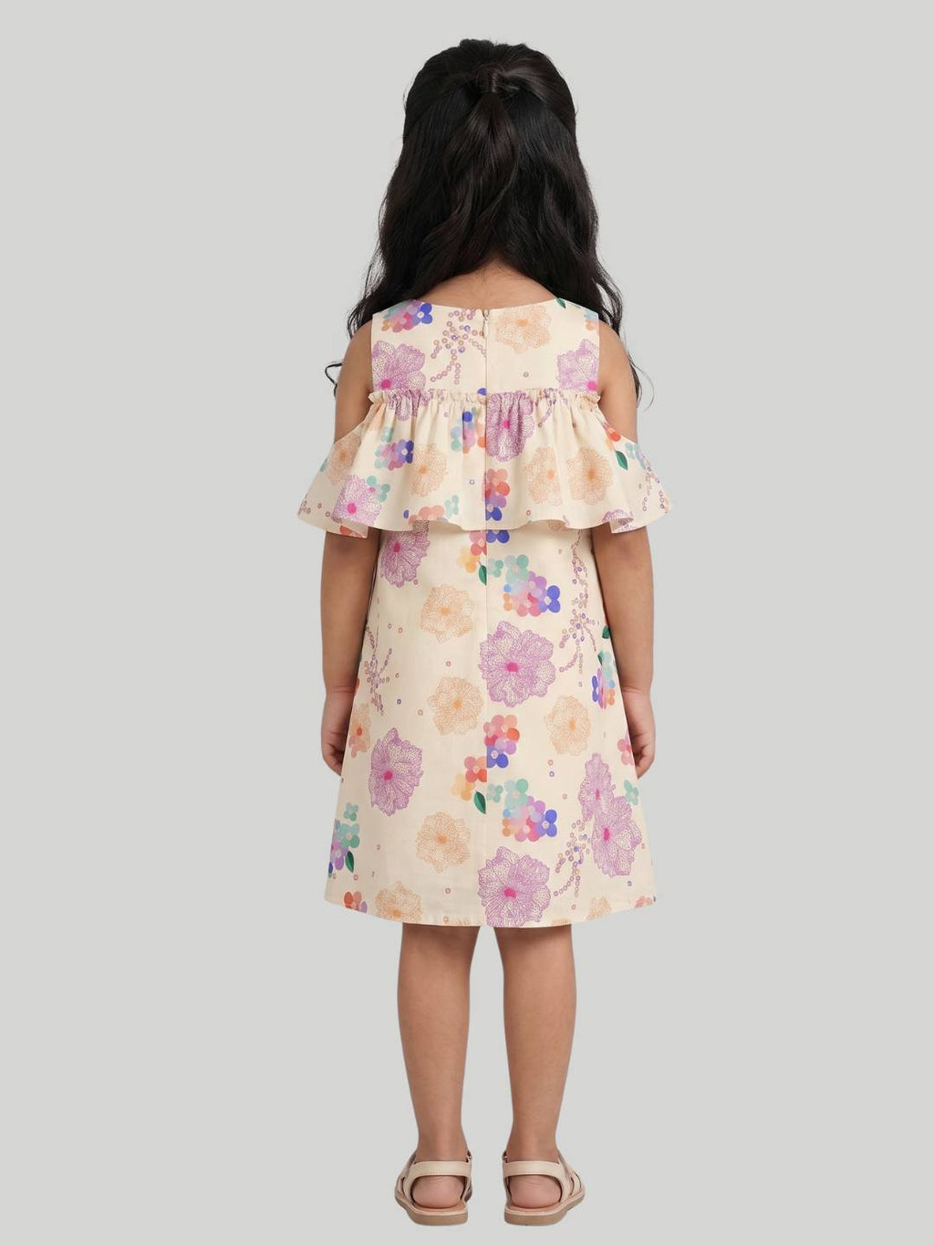 Cold-shoulder floral dress with ruffle overlay detail.