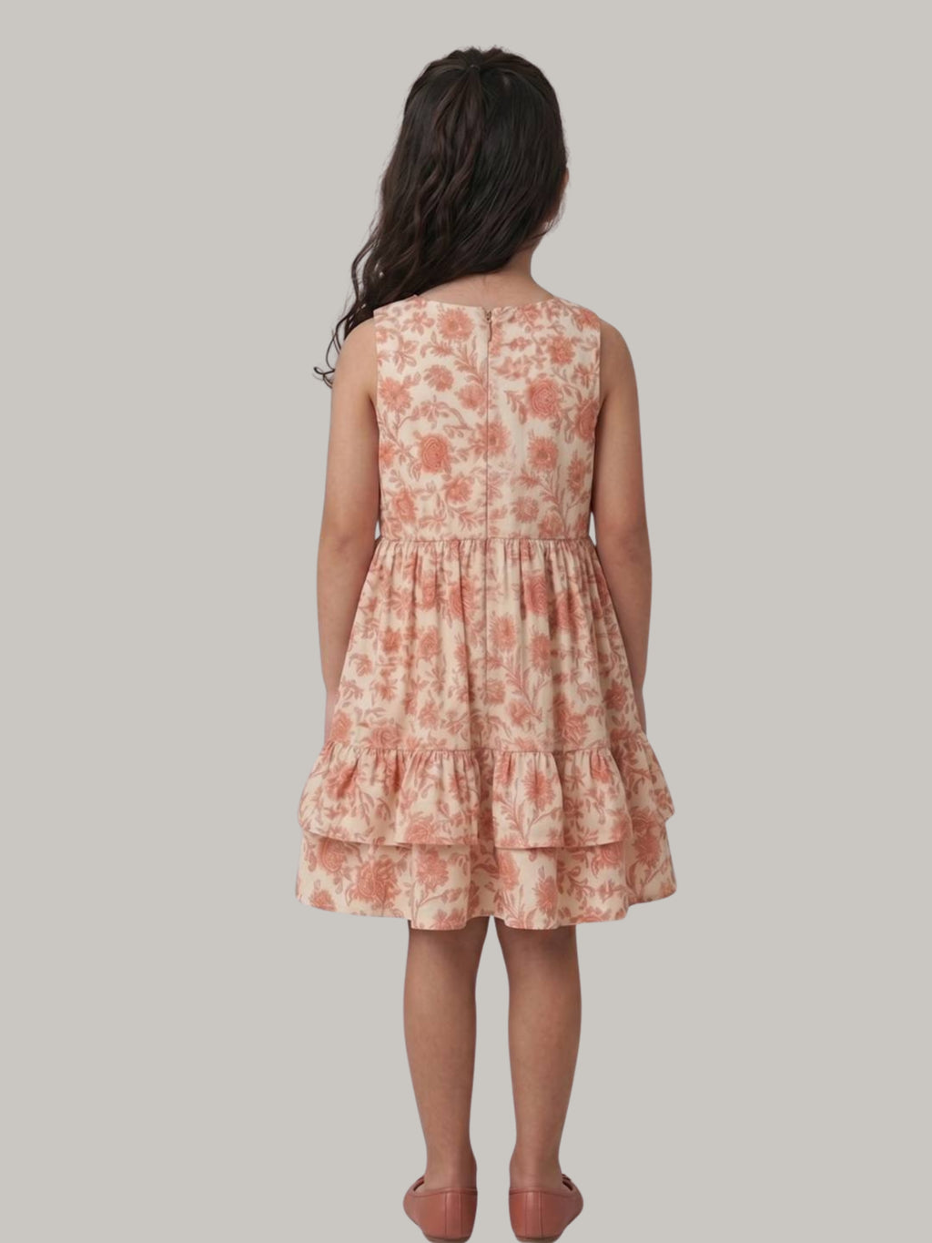Peach floral printed sleeveless tiered dress for girls.